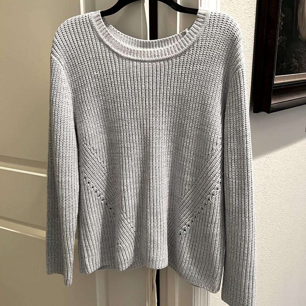 Sweater with tie accent in back size M. Pre owned and worn once.
